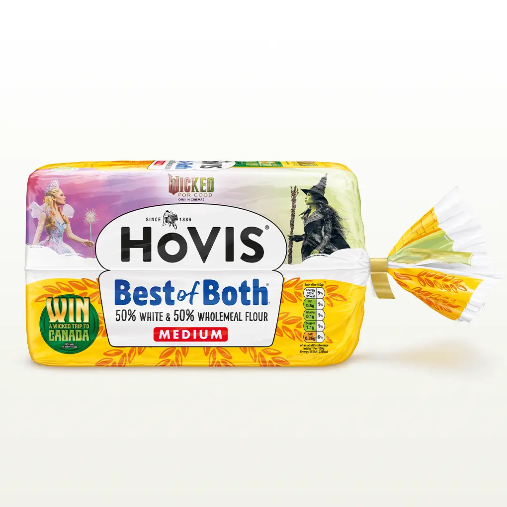 A Hovis Best of Both loaf medium sliced sits within a white back drop with a subtle shadow below the bread. 