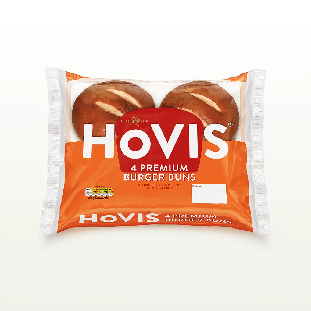 Four Hovis Burger Buns in a transparent square packaging featuring the Boy on the Bike, a grey stripe, golden wheat, and the Hovis logo on top.
