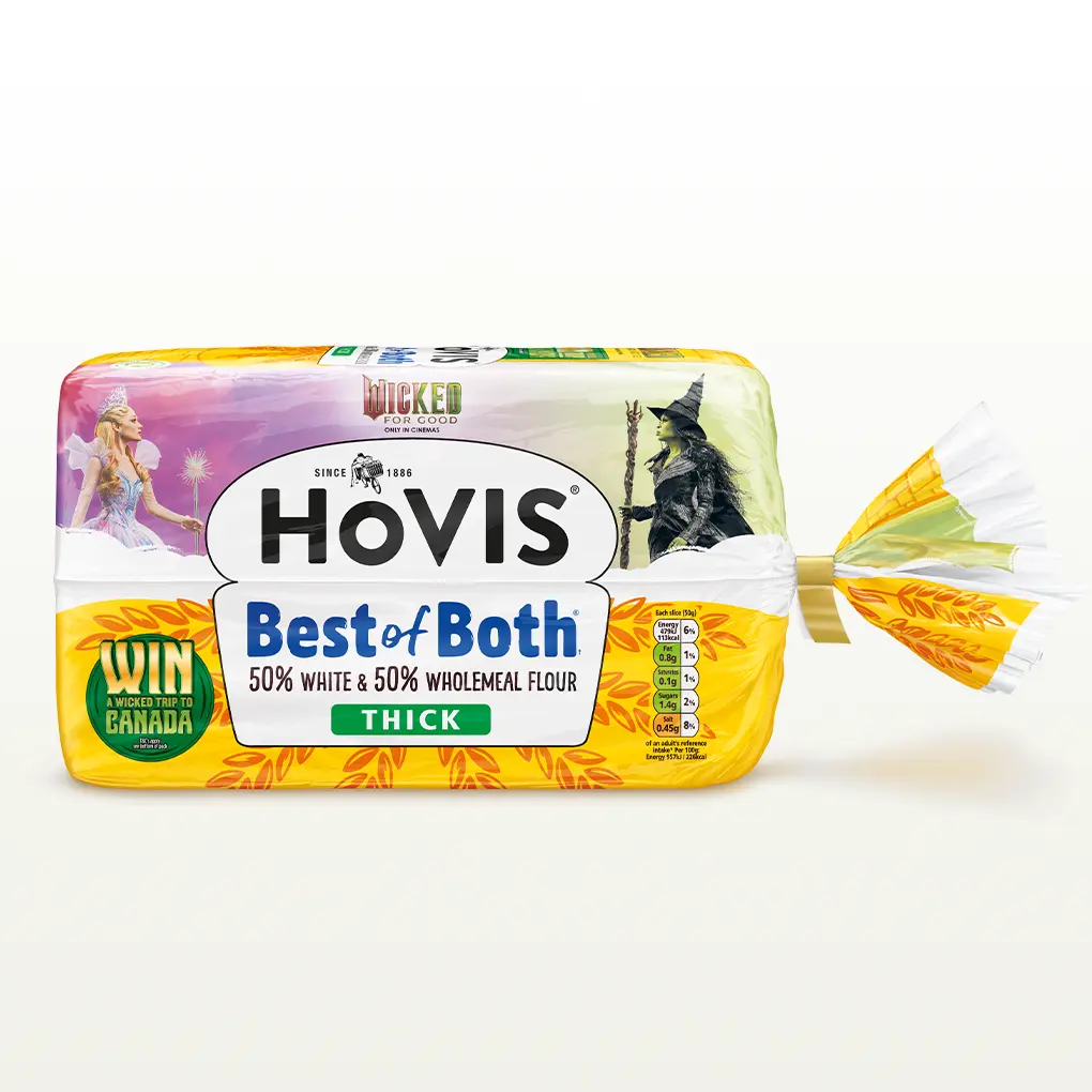 A Hovis Best of Both loaf thickly sliced sits within a white back drop with a subtle shadow below the bread. 
