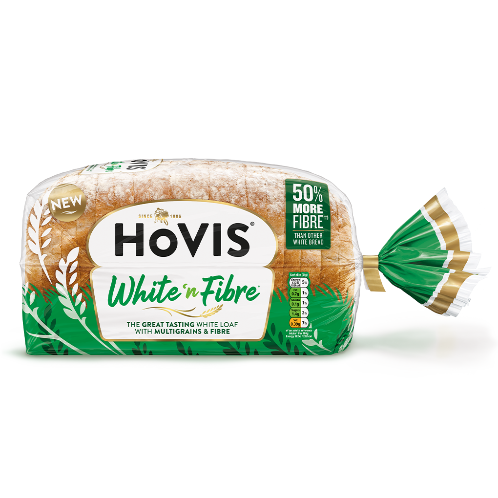 Hovis White n Fibre bread on a white backdrop with a subtle shadow. The packaging is half transparent and green, decorated with wheats.