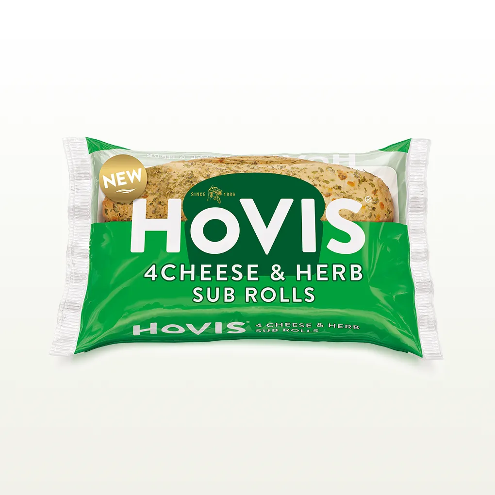 The pack shows two soft sub rolls with herbs and highlights “Deliciously soft fusion of cheese and herbs.” The pack sits on a white backdrop with a subtle shadow.
