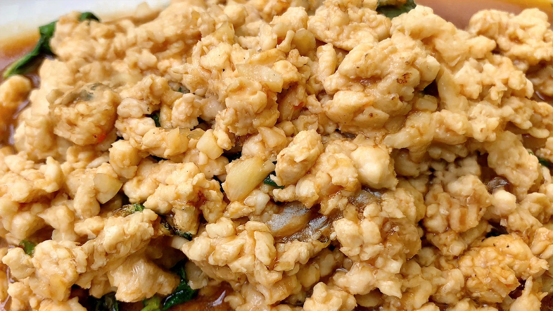A close up image of some crispy pork mince being cooked