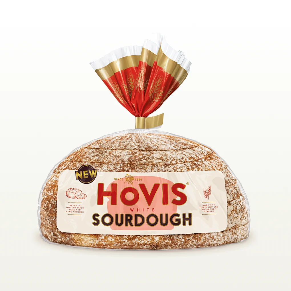 A loaf of Hovis White Sourdough sits in a cream background