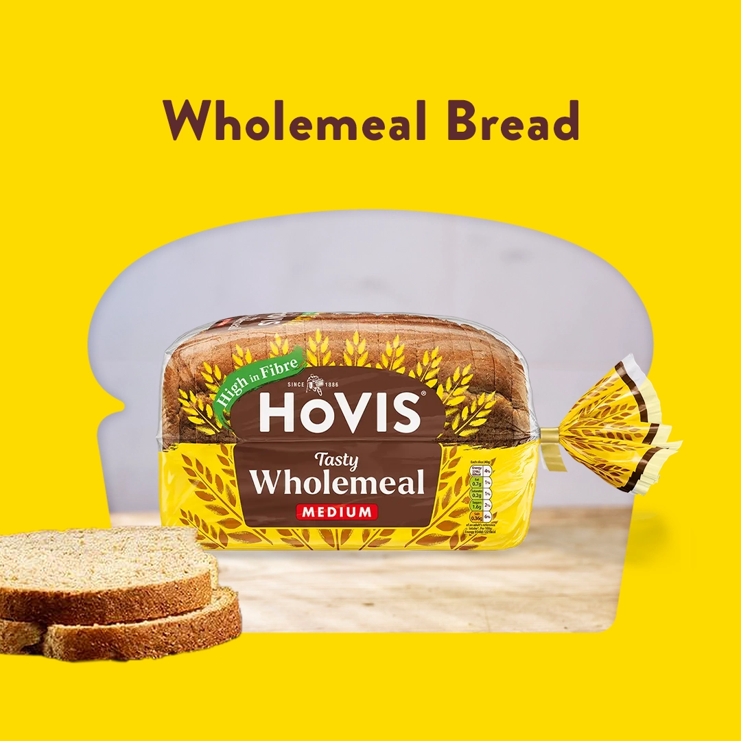 The text reads: Wholemeal bread. A Hovis wheatgerm loaf sits in a red background and cropped into a loaf shape